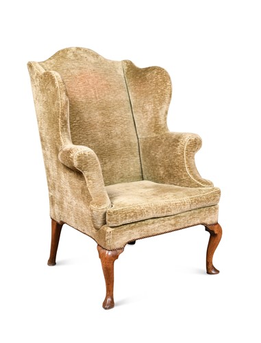 Lot 141 - A walnut wing back arm chair, 18th century