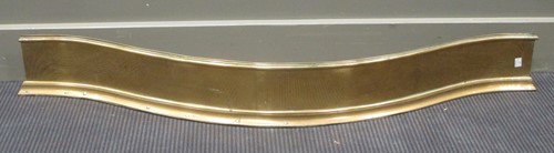 Lot 423 - A 19th century brass serpentine fender 125cm...