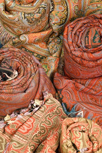 Lot 173 - A collection of four jacquard woven 'paisley' shawls, 19th century
