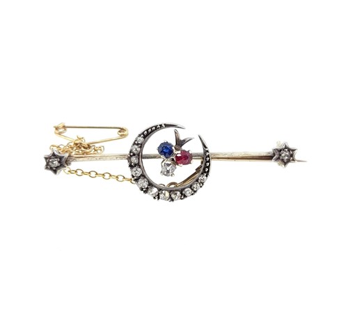 Lot 175 - A diamond, sapphire and ruby crescent bar brooch