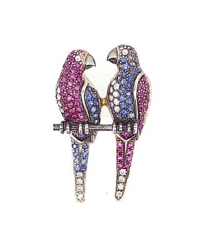 Lot 140 - A diamond, sapphire and ruby set parrot brooch
