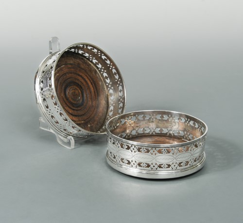 Lot 360 - A pair of Victorian silver bottle coasters