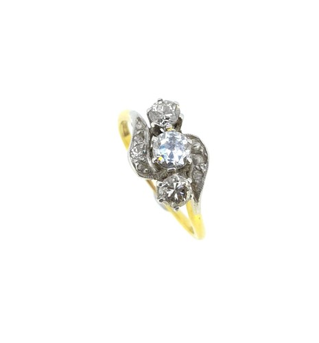 Lot 118 - A three stone diamond crossover ring