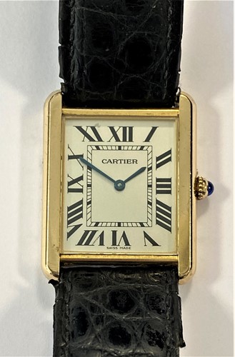 Lot 235 - Cartier - A Swiss 18ct gold and stainless steel 'Tank Solo' wristwatch
