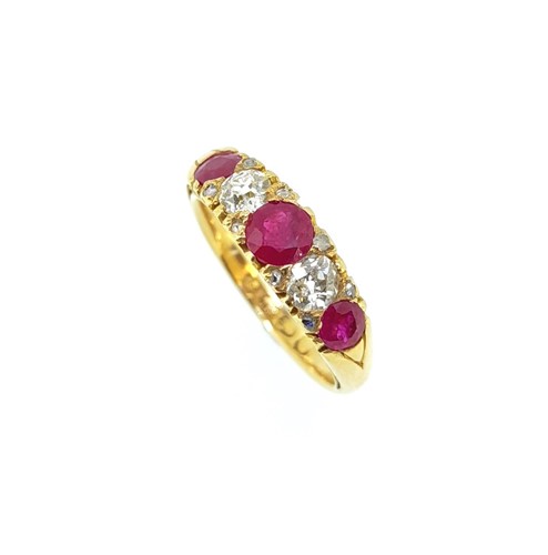 Lot 155 - An 18ct gold ruby and diamond carved head ring