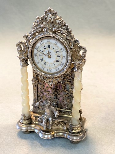 Lot 291 - Unsigned - A (probably) German metalwares silver miniature clock
