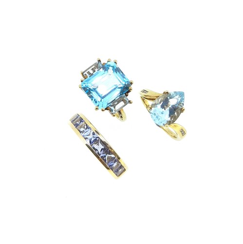 Lot 106 - A trio of blue stone gem set dress rings