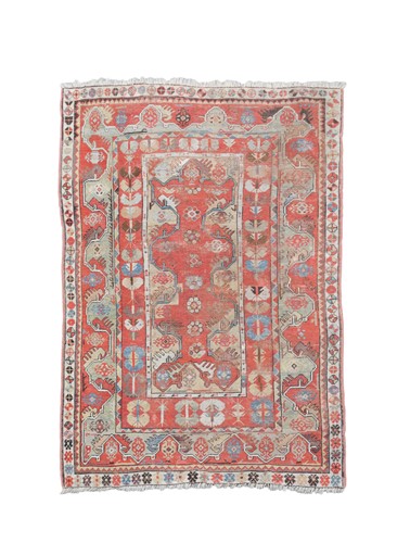 Lot 183 - A Melaz red ground rug, 19th century