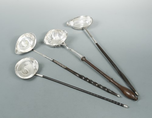 Lot 328 - Four punch ladles, one set with a James II coin