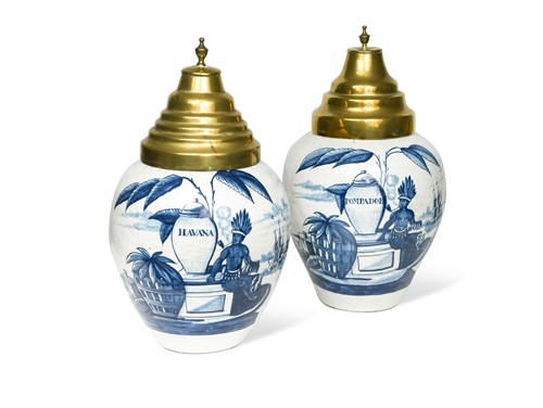 Lot 162 - A pair of Delft blue and white tobacco jars and covers