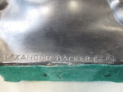 Lot 27 - An Alexander Backer Co. painted black pig...