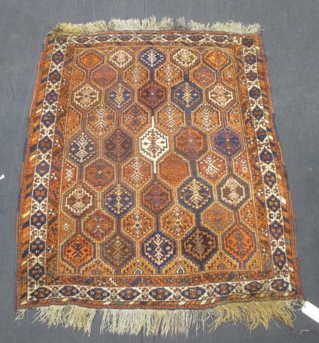 Lot 502 - A red and blue ground patterned Khamseh rug,...