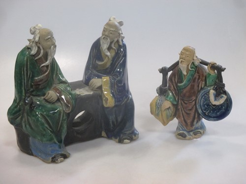 Lot 42 - Two Chinese pottery enamelled figures