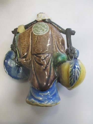 Lot 34 - Two Chinese pottery enamelled figures