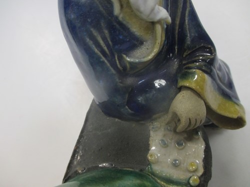 Lot 34 - Two Chinese pottery enamelled figures