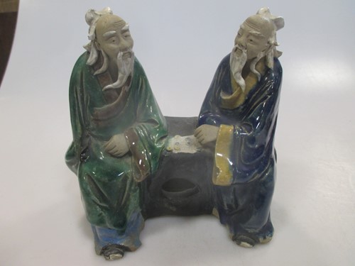 Lot 34 - Two Chinese pottery enamelled figures
