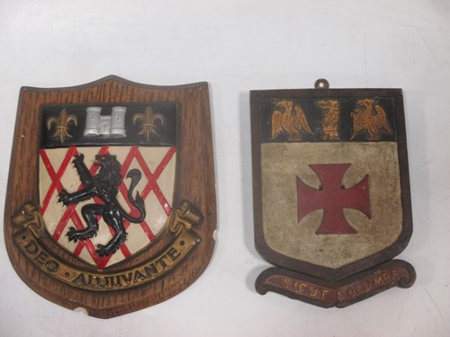Lot 23 - An early 20th century painted armorial shield...