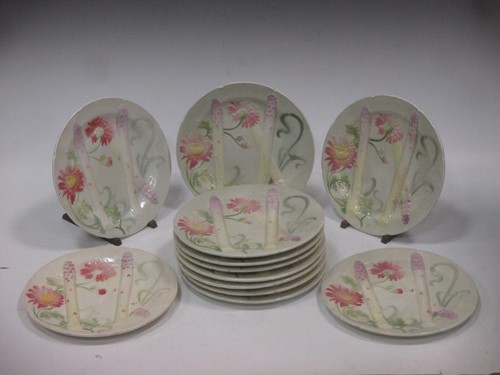Lot 12 - A set of twelve asparagus plates marked St...