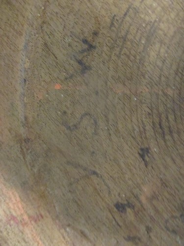 Lot 32 - A large red painted wooden platter, 53cm diameter