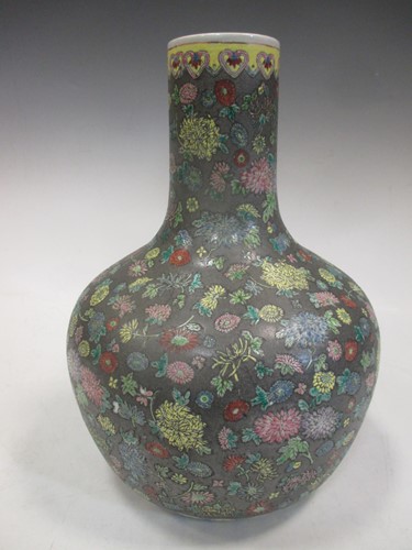 Lot 165 - A Chinese bottle necked vase decorated with...