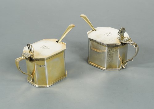 Lot 442 - A near pair of George V silver gilt mustards