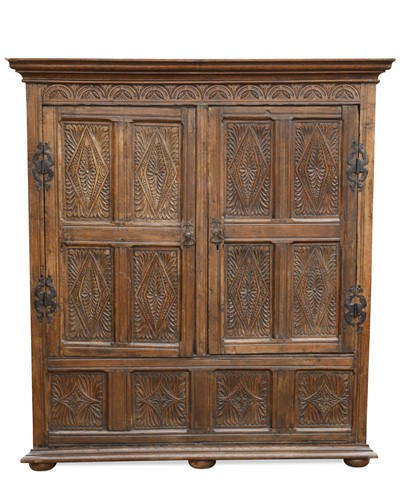Lot 539 - A carved oak panelled livery cupboard, 19th century