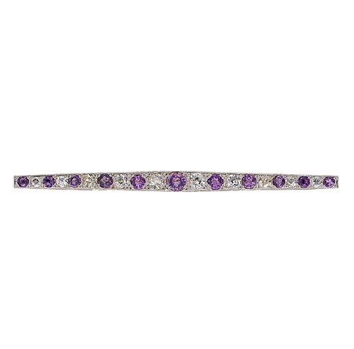 Lot 30 - An Art Deco amethyst and diamond bar brooch