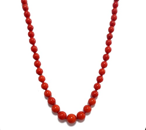 Lot 13 - A row of graduated coral beads