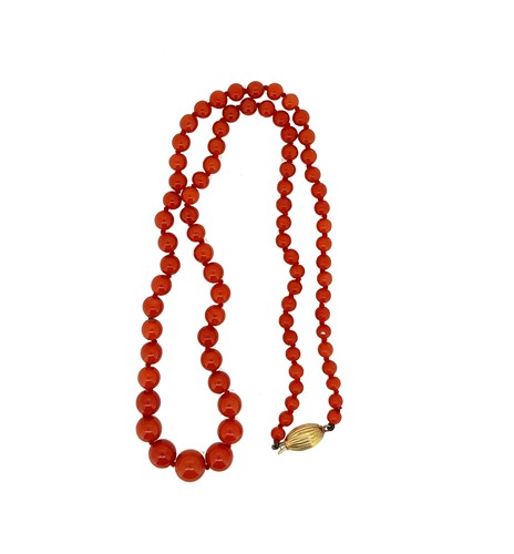 Lot 13 - A row of graduated coral beads