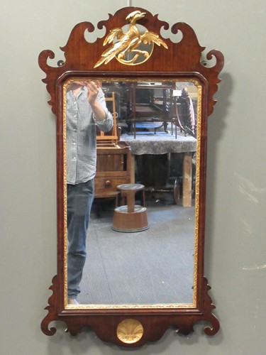 Lot 555 - A Chippendale style mirror with gilt ho ho...