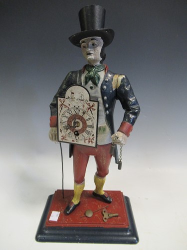 Lot 16 - A Continental 'peddler' clock, 40cm high approx