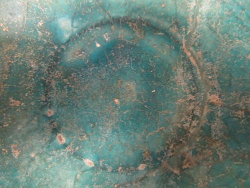 Lot 22 - A Kashan pottery green glazed dish, 15cm diameter
