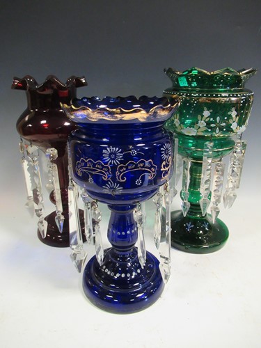 Lot 43 - Three glass lustres, in green, blue and ruby,...