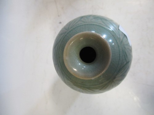 Lot 20 - A Chinese celadon glazed meiping vase carved...