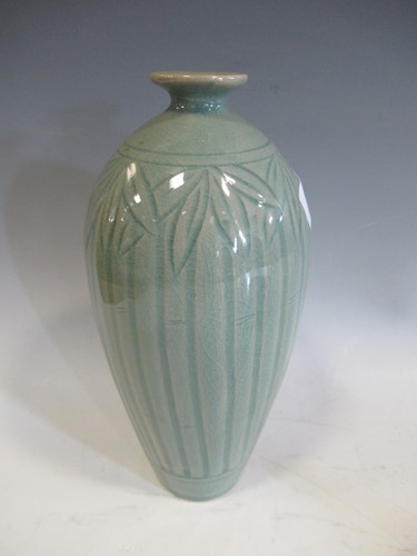 Lot 20 - A Chinese celadon glazed meiping vase carved...