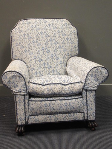 Lot 399 - Circa 1900 a scroll arm armchair on carved...
