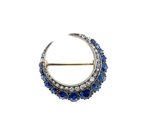 Lot 71 - A sapphire and diamond closed crescent brooch