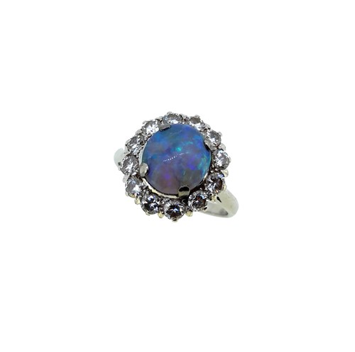 Lot 51 - A black opal and diamond cluster ring