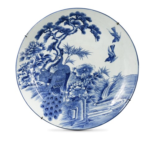 Lot 91 - A Japanese blue and white porcelain large peacock charger, late Meiji Period (1868-1912)