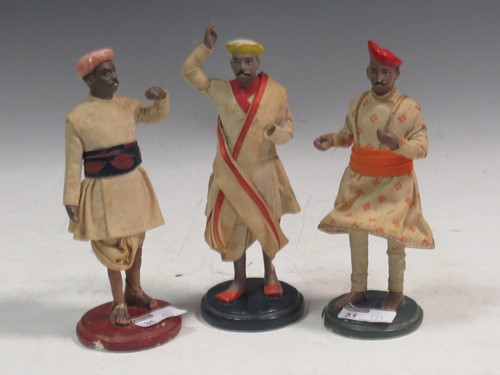 Lot 31 - Three Indian painted plaster figures in...