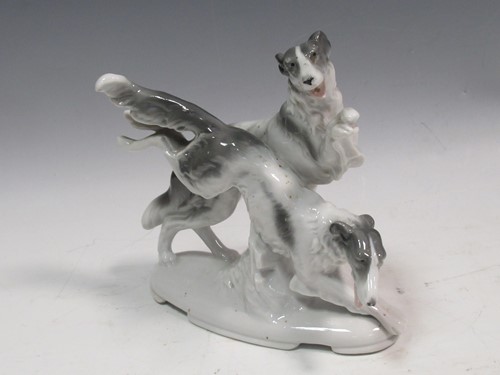 Lot 27 - A model of two Borzoi leaping, mark on underside