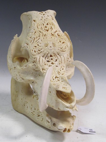 Lot 29 - An ornately carved Wild Boar skull