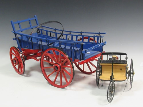 Lot 44 - A wooden model of a cart and a miniature model...