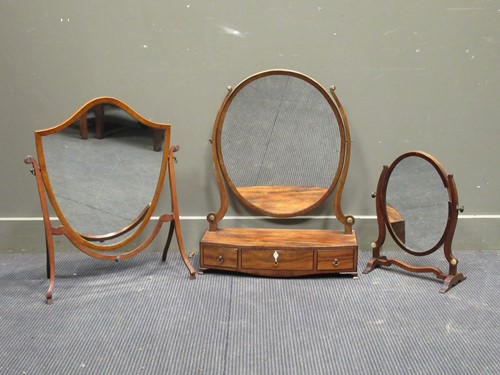 Lot 390 - Regency mahogany oval dressing table mirror,...