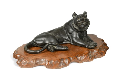 Lot 85 - A Japanese bronze of a reclining tiger