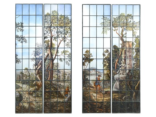 Lot 140 - A pair of pastoral scenes in stained glass