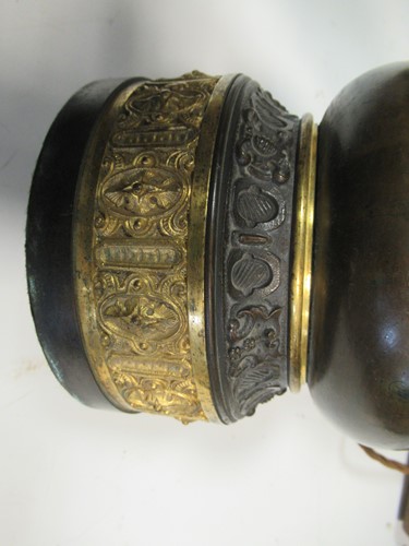 Lot 37 - A pair of patinated and gilt wall lights...