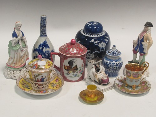 Lot 130 - A Dresden two handled chocolate cup and cover...