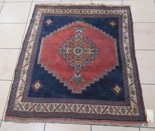 Lot 706 - A hand-knotted Kazak style rug, circa 1950