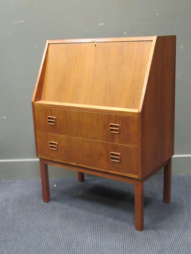 Lot 646 - A 20th century teak bureau, the fall front...